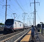 Another railfan enjoys the fast moving action of Amtrak Train # 653